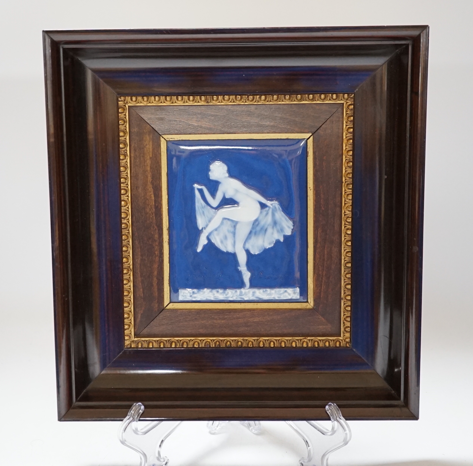A Limoges pate sur pate plaque of a dancing girl, signed, 11cm wide x 13cm high